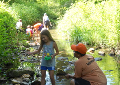 Howard County Conservancy campers find animals and learn about stream health at the Davis Branch stream during Summer Nature Day Camps at Mt. Pleasant