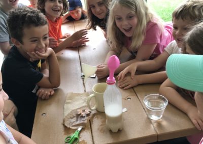 Campers at the Howard County Conservancy's Summer Nature Camp experiment with yeast during a STEM program.