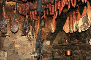 Meats hanging in smokehouse