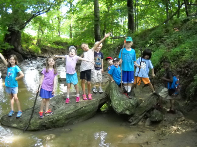 Campers from Howard County Conservancy's Summer Nature Camp at Mt. Pleasant across the Davis Branch stream